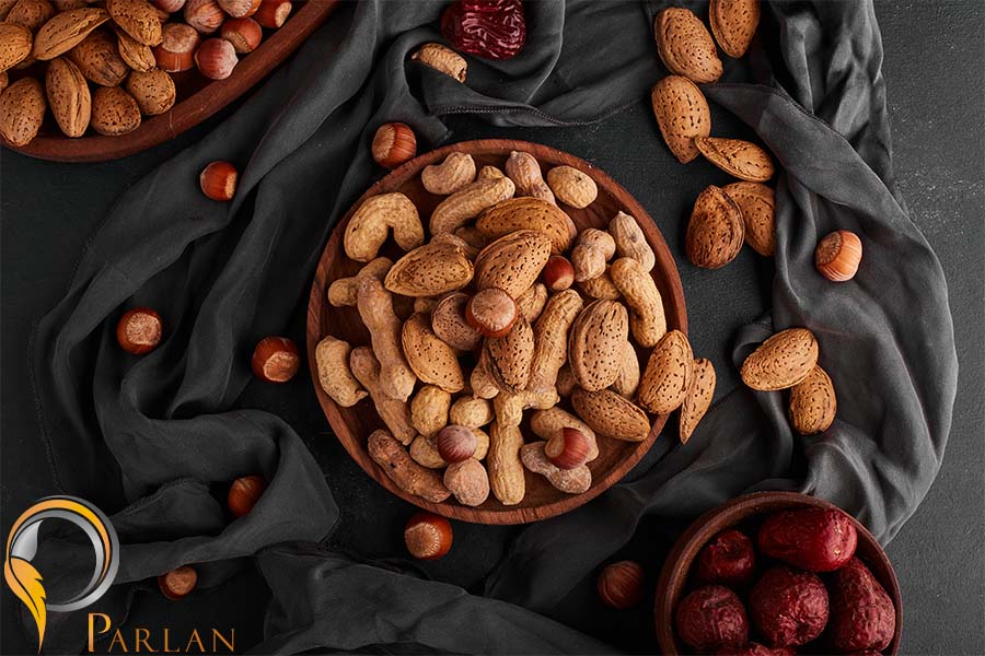nuts almond shells wooden plate with dry fruits around