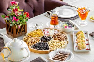 top view mix nuts with dried fruits wooden plate served with tea sweets table restaurant